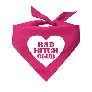 May include: Pink bandana with a white heart that says "BAD BITCH CLUB" in pink letters.