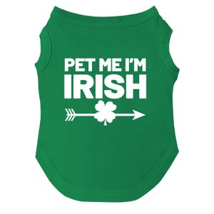 May include: Green sleeveless dog shirt with white text that says "Pet Me I'm Irish" and a white shamrock with an arrow.