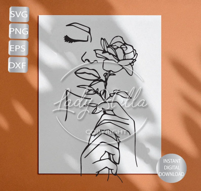 May include: Line art drawing of a woman's face with closed eyes, holding a single rose with a stem and leaves. The drawing is in black and white and has a minimalist style.