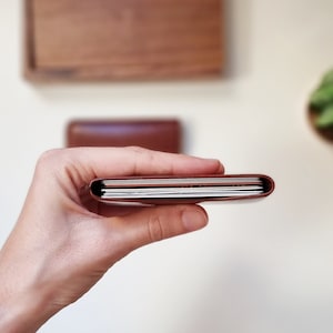 card sleeve shown from above and open. Inside the leather card holder there are 10 cards, so it has a large capacity.