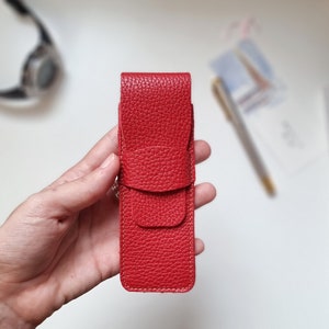 pen sleeve pouch in bright leather red. This pen sleeve pouch is made of full grain leather that feels very soft. It is capacity for two pen