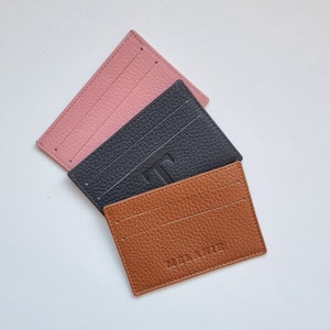 slim leather card holder, shown in three available colors, gray, burgundy and rose pink. You can personalize your card holder with your name or a larger initial.