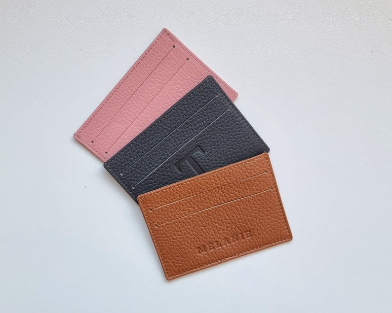 slim leather card holder, shown in three available colors, gray, burgundy and rose pink. You can personalize your card holder with your name or a larger initial.