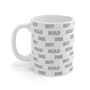 May include: White ceramic mug with a black and white pattern of the words "BUY", "HOLD", and "DRS" repeated.