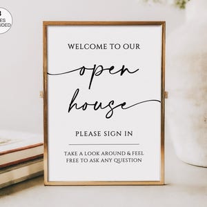 May include: A framed sign with gold trim and white background. The sign reads "WELCOME TO OUR open house PLEASE SIGN IN TAKE A LOOK AROUND & FEEL FREE TO ASK ANY QUESTION." A small circle in the upper left corner says "3 SIZES INCLUDED."