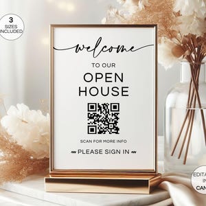 Könnte beinhalten: Ein goldgerahmtes Schild mit den Worten "welcome to our open house" in schwarzer Schrift. Unter dem Text befindet sich ein QR-Code mit den Worten "scan for more info" und "please sign in". Das Schild steht auf einem goldenen Ständer.
