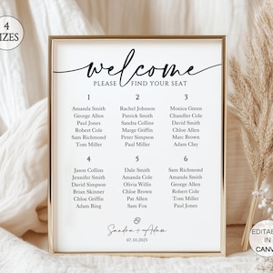 May include: A gold-framed wedding seating plan. The white background displays the words "welcome, please find your seat" in script. Names are listed under numbers 1-6. The date is 07.10.2025. The frame is approximately 30 cm x 40 cm.
