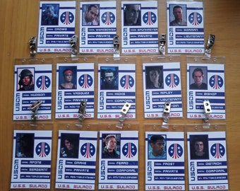 May include: Ten plastic ID badges with blue and white designs. Each badge features a character from the movie Aliens, their name, rank, and the text "USCM U.S.S. Sulaco".