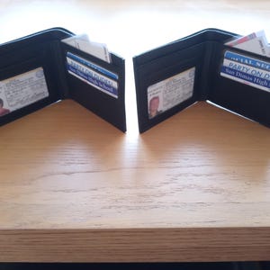 May include: A rustic wooden sign with the text "Welcome to our home" in white lettering. The sign features a distressed finish and a simple, inviting design, perfect for entryway decor.