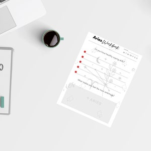 May include: A black and white printable worksheet titled "Aries Workbook" with a gray floral design and stars. The worksheet includes the questions "Do you have healthy coping skills?" and "What makes you feel the most ambitious?"