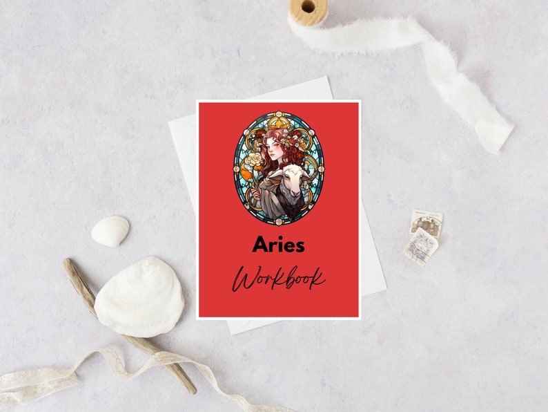 May include: A red workbook with a stained glass illustration of a woman with a ram. The title "Aries Workbook" is printed in black.