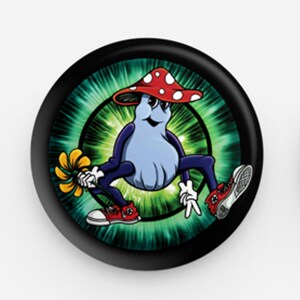 May include: A black button with a green and black psychedelic background. A cartoon mushroom character with red and white spots on its cap is wearing sneakers and holding a yellow flower.