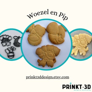 Op de afbeelding: Drie hondvormige koekjesvormen en drie koekjes die met de vormen zijn uitgestoken. De vormen zijn van zwart plastic en de koekjes zijn lichtbruin. De tekst "Woezel en Pip" is in zwart op een witte achtergrond boven de koekjes gedrukt. De tekst "printkt3ddesign.etsy.com" is in zwart op een witte achtergrond onder de koekjes gedrukt. De tekst "PRINKT-3D design en 3D printing" is in zwart op een witte achtergrond onder het websiteadres gedrukt.
