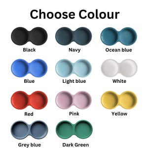 May include: A color chart titled Choose Colour displaying eleven double-bowl silicone dishes in black, navy, ocean blue, blue, light blue, white, red, pink, yellow, grey blue, and dark green. Each item features two circular connected basins.