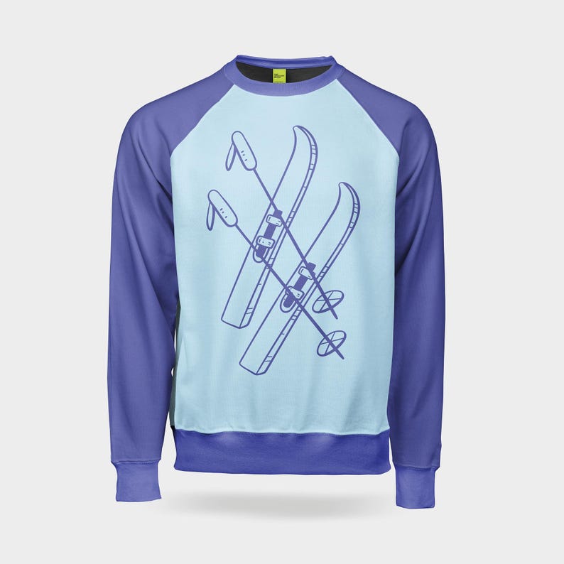 May include: A blue and light blue long-sleeved sweatshirt with a graphic of two crossed skis and ski poles on the front.