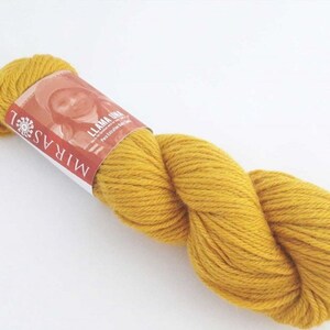 Mirasol Llama Una yarn color 8218.  This is a discontinued baby llama yarn.  To find a suitable yarn substitute, go to www.yarnsub.com, type Mirasol Llama Una into the search box, and press enter.  The most suitable is listed at the top.
