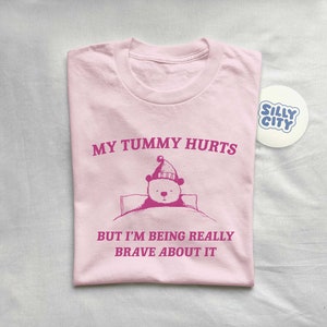 My Tummy Hurts But I'm Being Really Brave About It Unisex T Shirt imagen 3