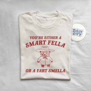 Are You A Smart Fella Or Fart Smella Retro Cartoon T Shirt, Weird T Shirt, Meme T Shirt, Trash Panda T Shirt, Unisex zdjęcie 1