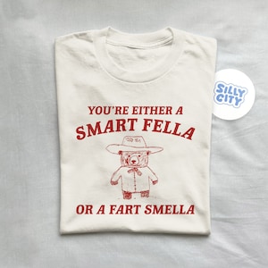 You're either a smart fella or a fart smella - unisex t shirt