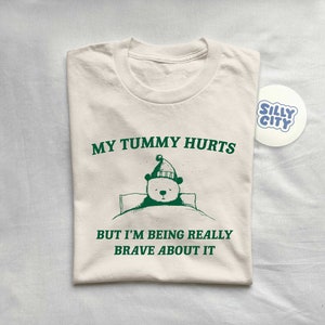 My Tummy Hurts But I'm Being Really Brave About It Unisex T Shirt image 1