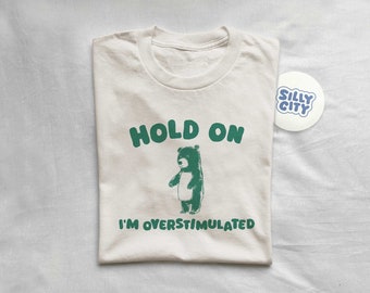 Hold On I'm Overstimulated - Unisex T Shirt
