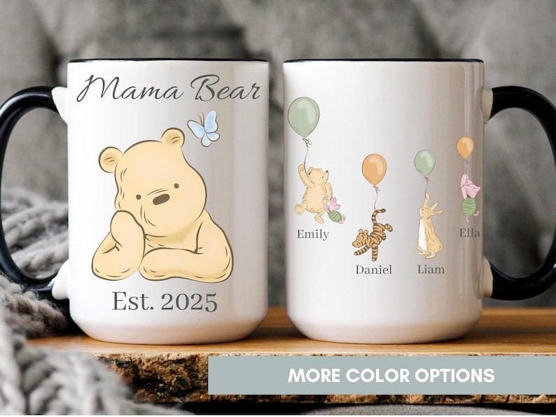 White ceramic mug with black handle featuring Winnie the Pooh and friends holding balloons, personalized with children's names and “Mama Bear” text