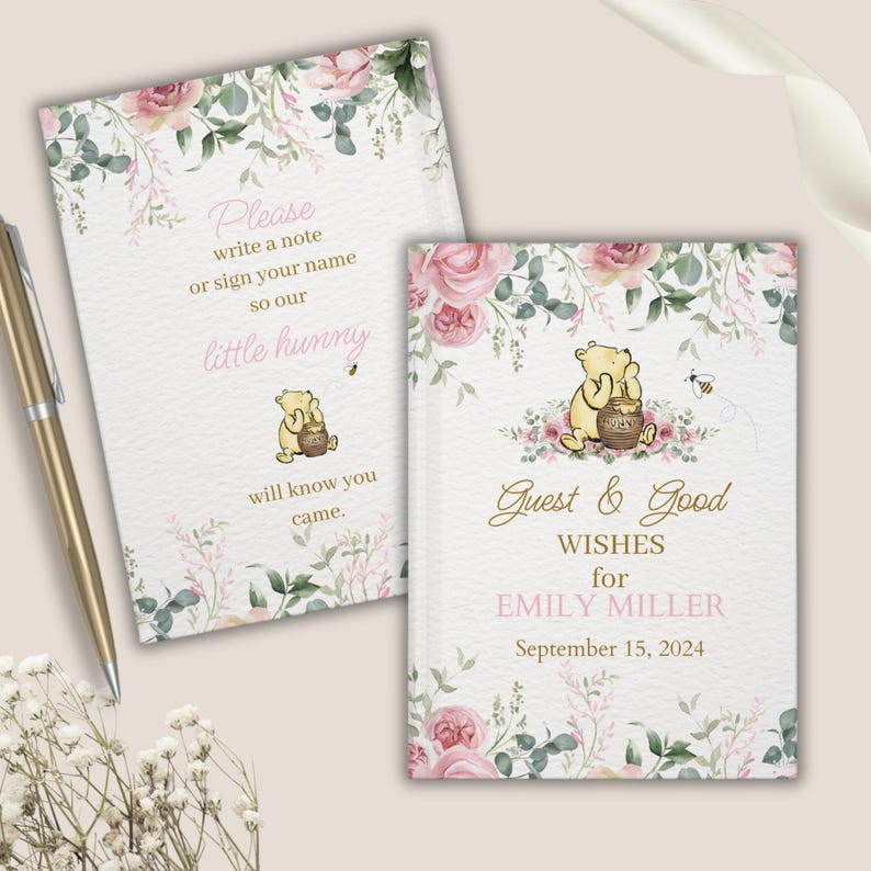 May include: Two floral guest books with Winnie the Pooh illustrations. The first book says "Please write a note or sign your name so our little hunny will know you came." The second book says "Guest & Good Wishes for Emily Miller September 15, 2024".