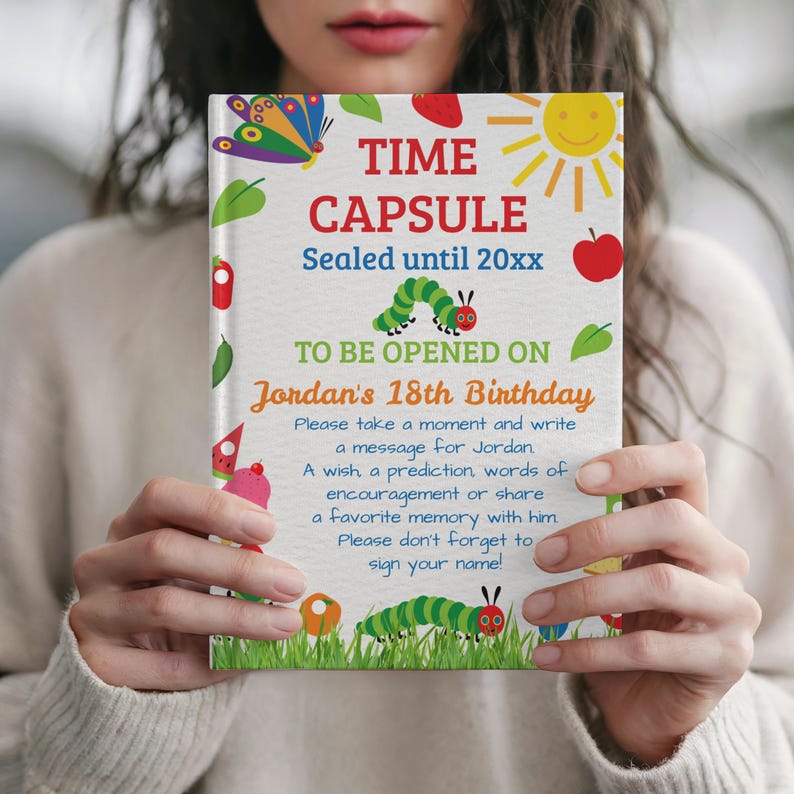 May include: A colorful time capsule book with the words "TIME CAPSULE" and "Sealed until 20xx". The book is decorated with a butterfly, sun, apple, and caterpillar illustrations. Text reads "TO BE OPENED ON Jordan's 18th Birthday".