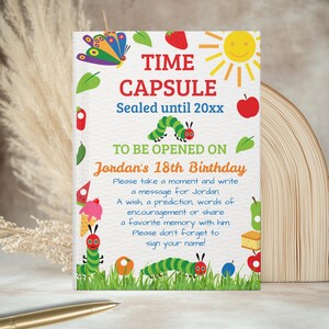 May include: A colorful time capsule card with the text "TIME CAPSULE" and "Sealed until 20xx". The card is decorated with illustrations of a butterfly, sun, apple, and caterpillars. The text reads "TO BE OPENED ON Jordan's 18th Birthday".