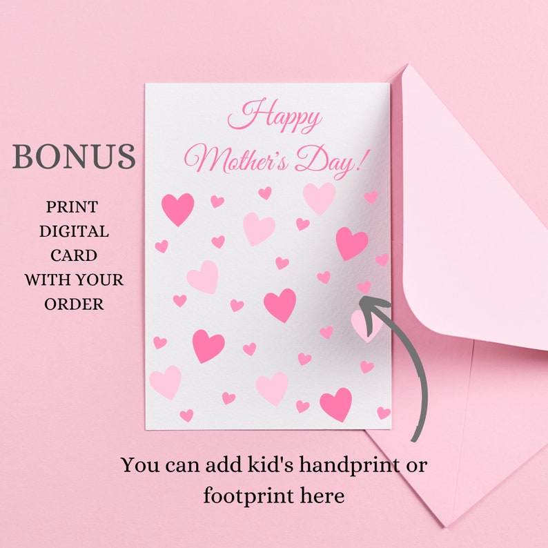 May include: A pink card with the text "Happy Mother's Day!" and a pattern of pink hearts. The card is in a pink envelope. The text "You can add kid's handprint or footprint here" is below the card.