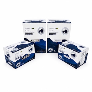 May include: Four white rectangular boxes of Jamaica Blue Mountain Premium Blend coffee pods. Two tall boxes contain 24 pods each, and two smaller boxes contain 12 pods each. The packaging features dark blue mountain graphics and text labels.