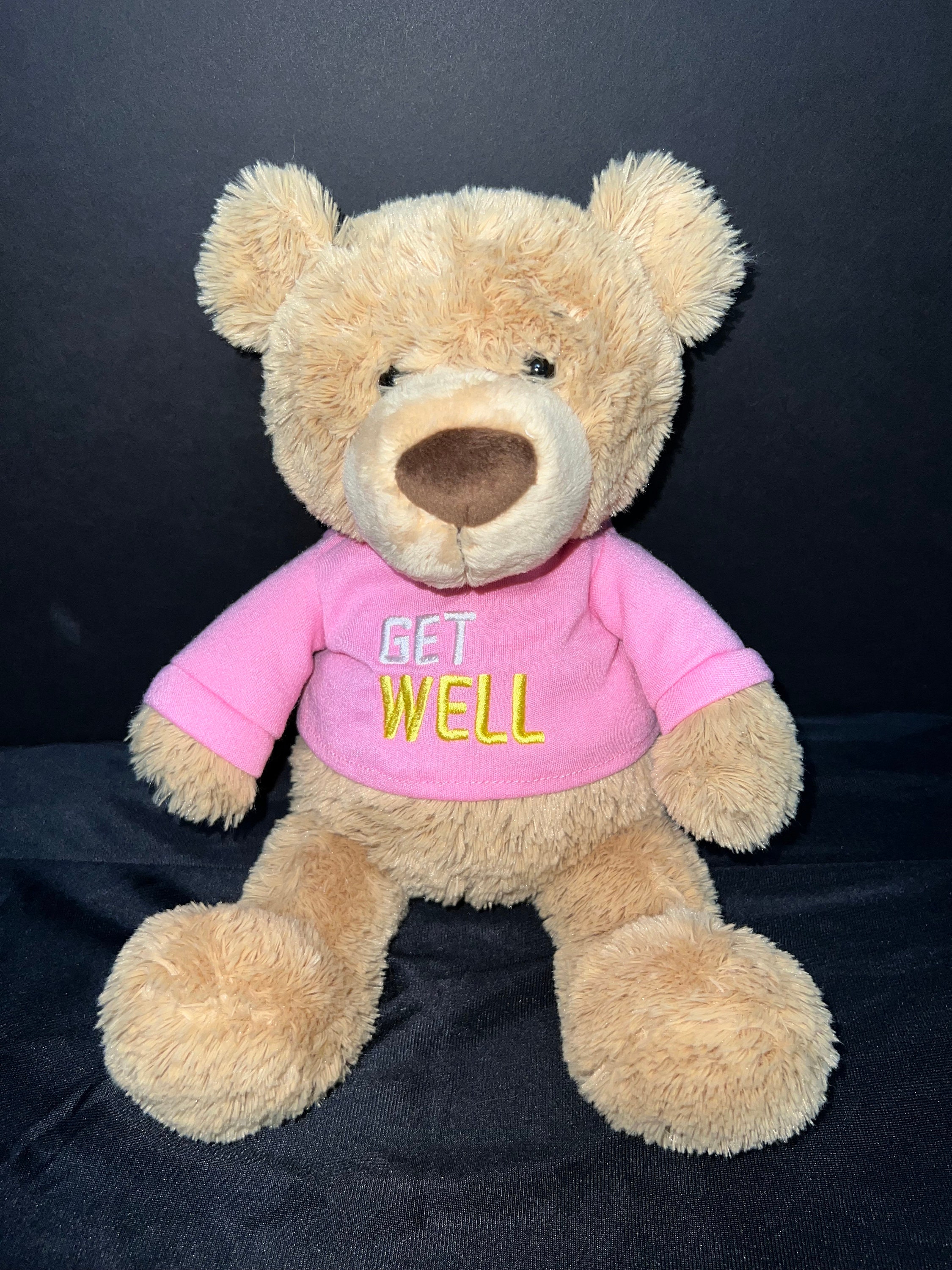 Get Well Soon Card. Teddy Bear with Bandaged Arm Stock