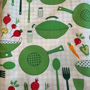 May include: A white fabric with a green and white checkered pattern. The fabric features a repeating pattern of green kitchen utensils, including spatulas, forks, spoons, and woks. There are also green and red vegetables, including radishes, onions, and peas.