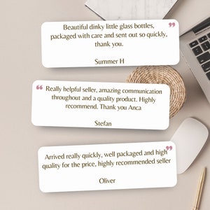 May include: Three customer reviews with positive feedback on a product. The reviews are written in a white box with a pink quote mark on the left and a black quote mark on the right. The reviews are on a white surface with a laptop, a mouse, and a woven placemat.
