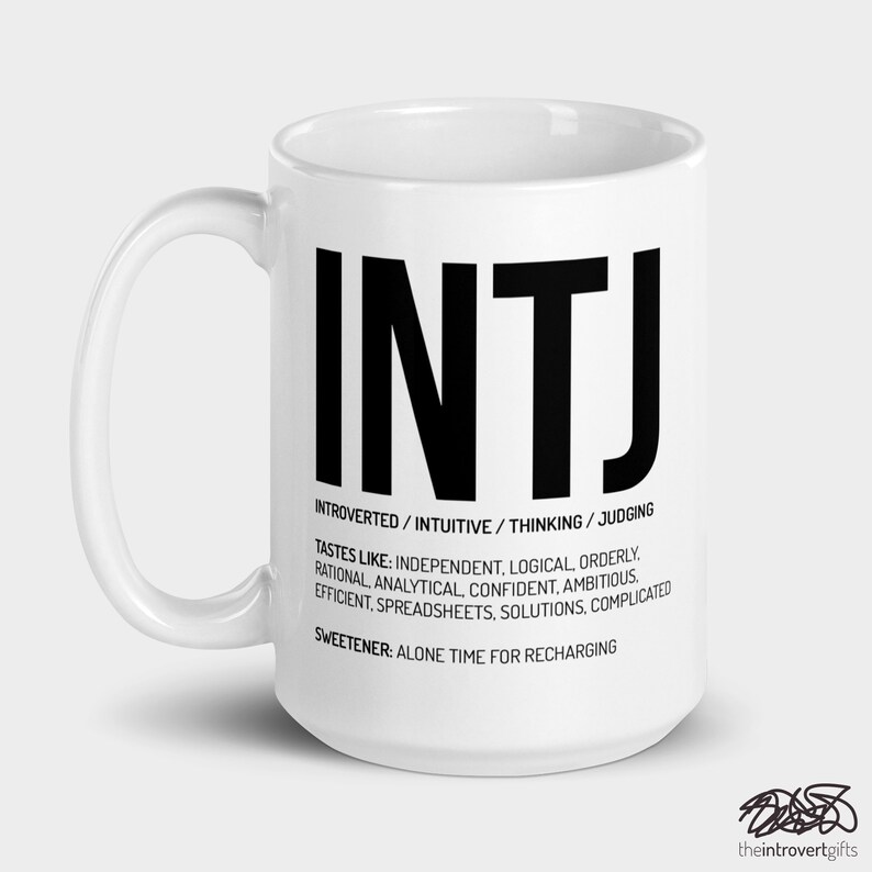 May include: White ceramic mug with a black graphic of the letters INTJ and the text "INTROVERTED/INTUITIVE/THINKING/JUDGING" and "TASTES LIKE: INDEPENDENT. LOGICAL ORDERLY. RATIONAL, ANALYTICAL, CONFIDENT, AMBITIOUS. EFFICIENT, SPREADSHEETS, SOLUTIONS, COMPLICATED" and "SWEETENER: ALONE TIME FOR RECHARGING".