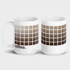 May include: Two white ceramic coffee mugs with a gradient of brown squares printed on the front. The mug on the left has the word "coffee." printed on the front.