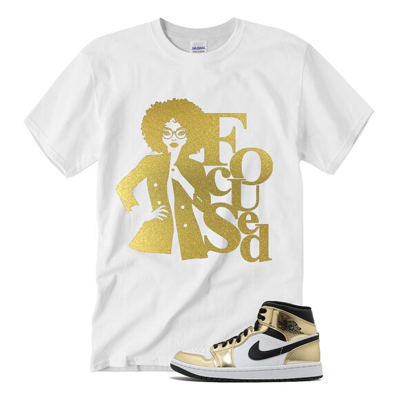 white and gold jordan shirt