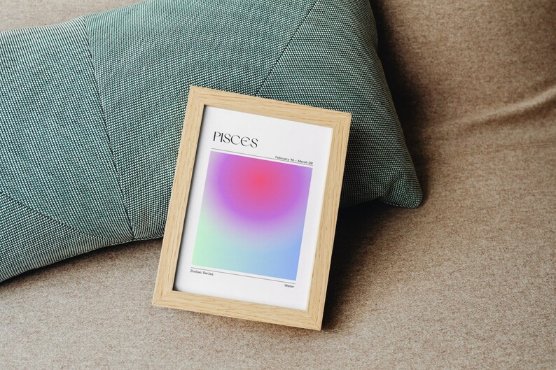 May include: A framed print with a gradient background in shades of blue, green, pink, and purple. The print features the word "Pisces" in black text and the dates "February 19 - March 20".