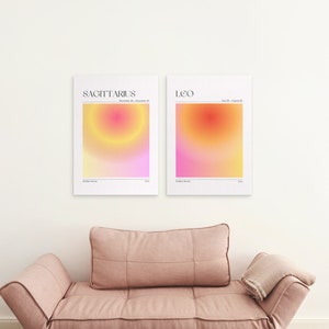 May include: Two minimalist zodiac prints with a gradient background in shades of pink, yellow, and orange. The prints feature the zodiac signs Sagittarius and Leo with their corresponding dates.