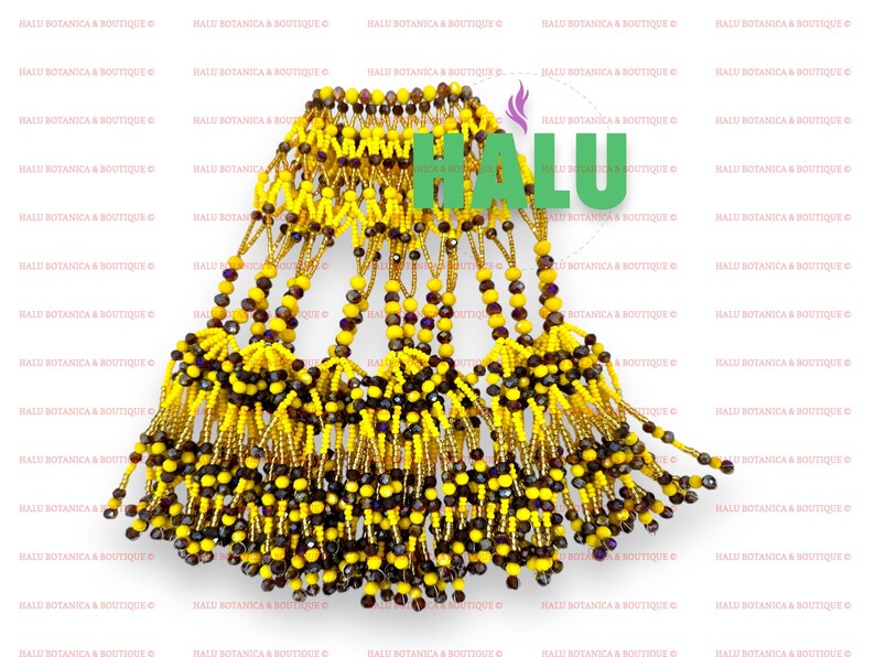 May include: A beaded necklace with a gold and yellow fringe. The necklace is made of small, round beads in shades of gold, yellow, and brown. The fringe is made of strands of beads that hang down from the necklace.