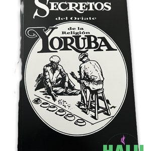 May include: A black book titled "Secretos del Oriate de la Religion Yoruba" with a black and white illustration of two men. The book has a white circle with the illustration and text on a black background.