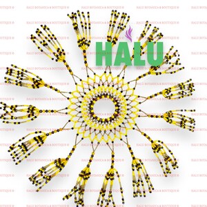 May include: A yellow and brown beaded sun catcher with a circular design and fringe. The sun catcher is made of small beads and has a woven pattern. The word "HALU" is visible in the center of the sun catcher.