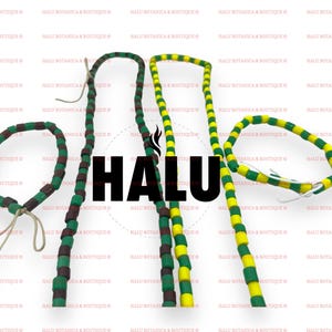 May include: Three beaded necklaces, one brown and green, one green and yellow, and one green and yellow with a smaller green and yellow beaded bracelet. All the necklaces are made of round beads and are strung together in a continuous loop.
