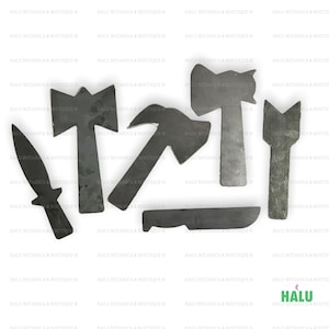 May include: A set of six metal tools, including a knife, an axe, a hammer, a saw, a chisel, and a spear. The tools are all made of a dark metal and have a rustic appearance.