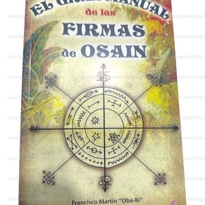 May include: A book titled "El Gran Manual de las Firmas de Osain" with a yellow, green, and brown cover. The cover features a circular symbol with a star, a sun, and other symbols. The book is by Francisco Martin "Oba-Bi".