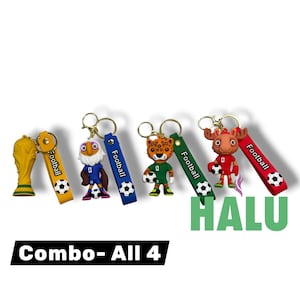May include: A collection of four football-themed keychains. The keychains feature a gold trophy, an eagle, a leopard, and a moose, each holding a soccer ball. Each keychain has a colored strap with the word "Football" and a soccer ball graphic.