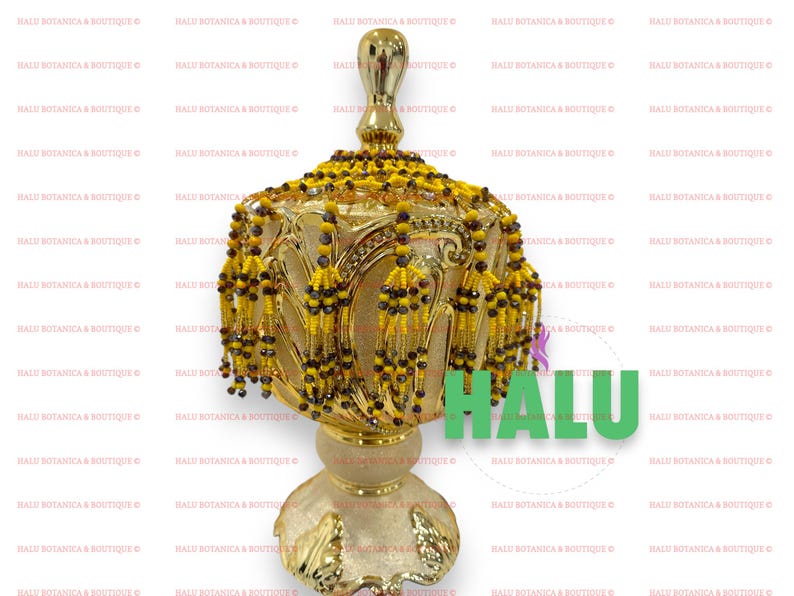 May include: A gold decorative stand with a round top and three legs. The stand is adorned with yellow and brown beaded tassels.