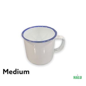 May include: White enamel mug with a blue rim and a handle. The mug is medium sized.