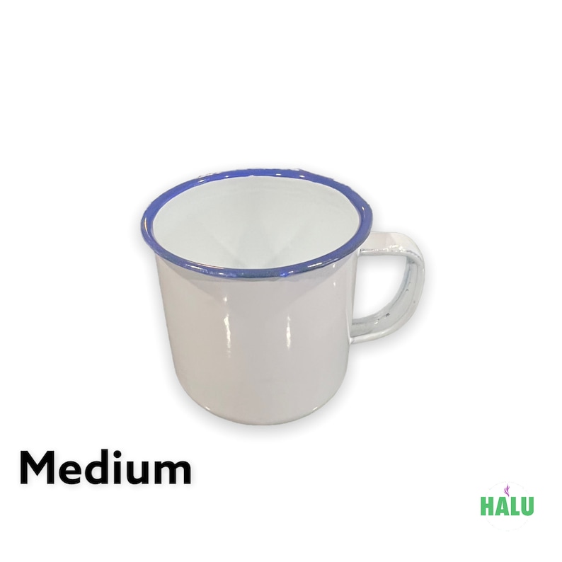 May include: White enamel mug with a blue rim and a handle. The mug is medium sized.