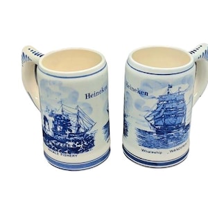 Pair of Vintage Heineken Delft Blue Stein Beer Mugs – Windmill & Whaleship “Wanderer” Design – GKB Holland Pottery